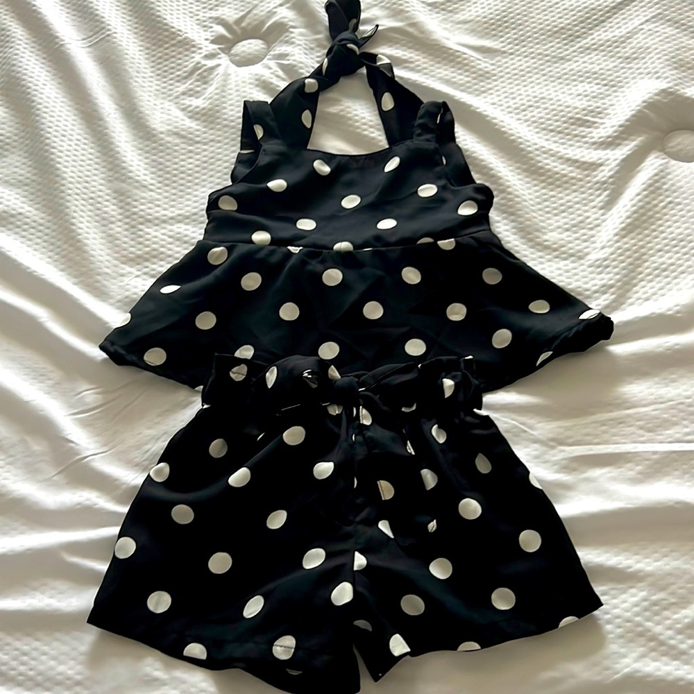 All black with white polkadots on dress